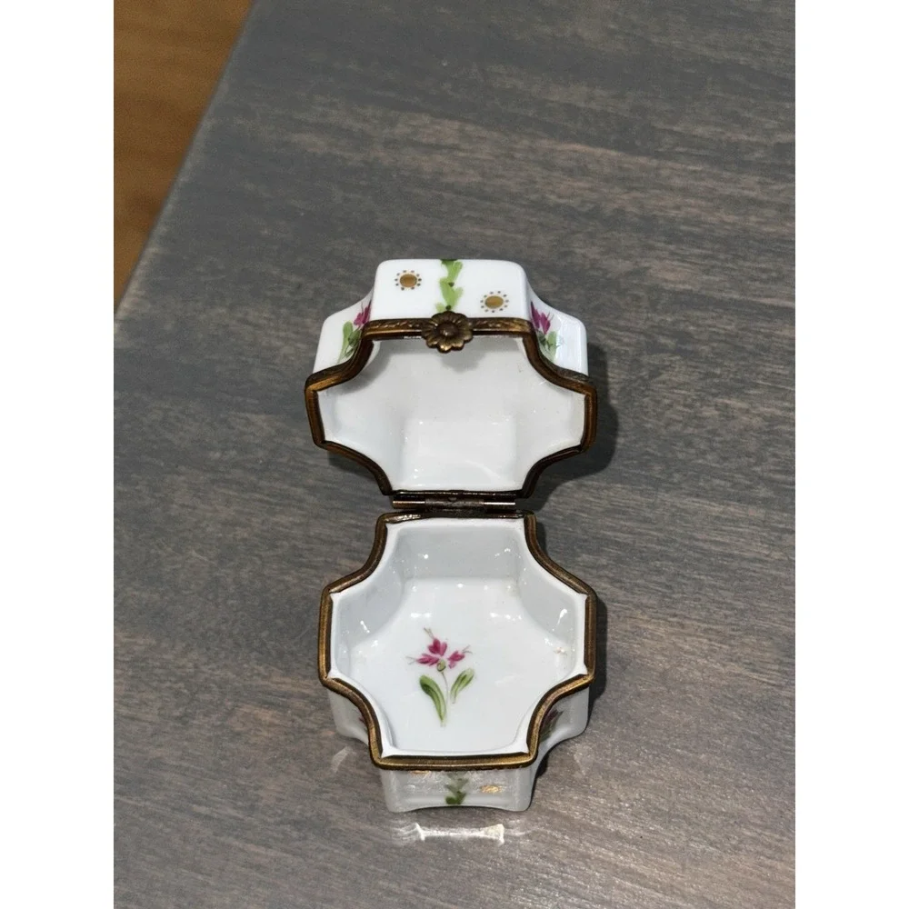 Beautiful authentic vintage French Limoges porcelain footed trinket box.